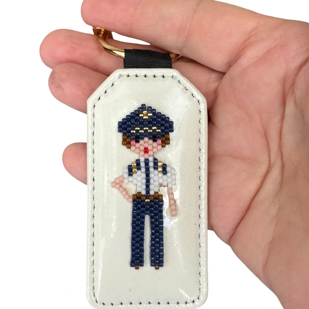 Hand Crafted Beaded Female Pilot Keychain with Gold Charms